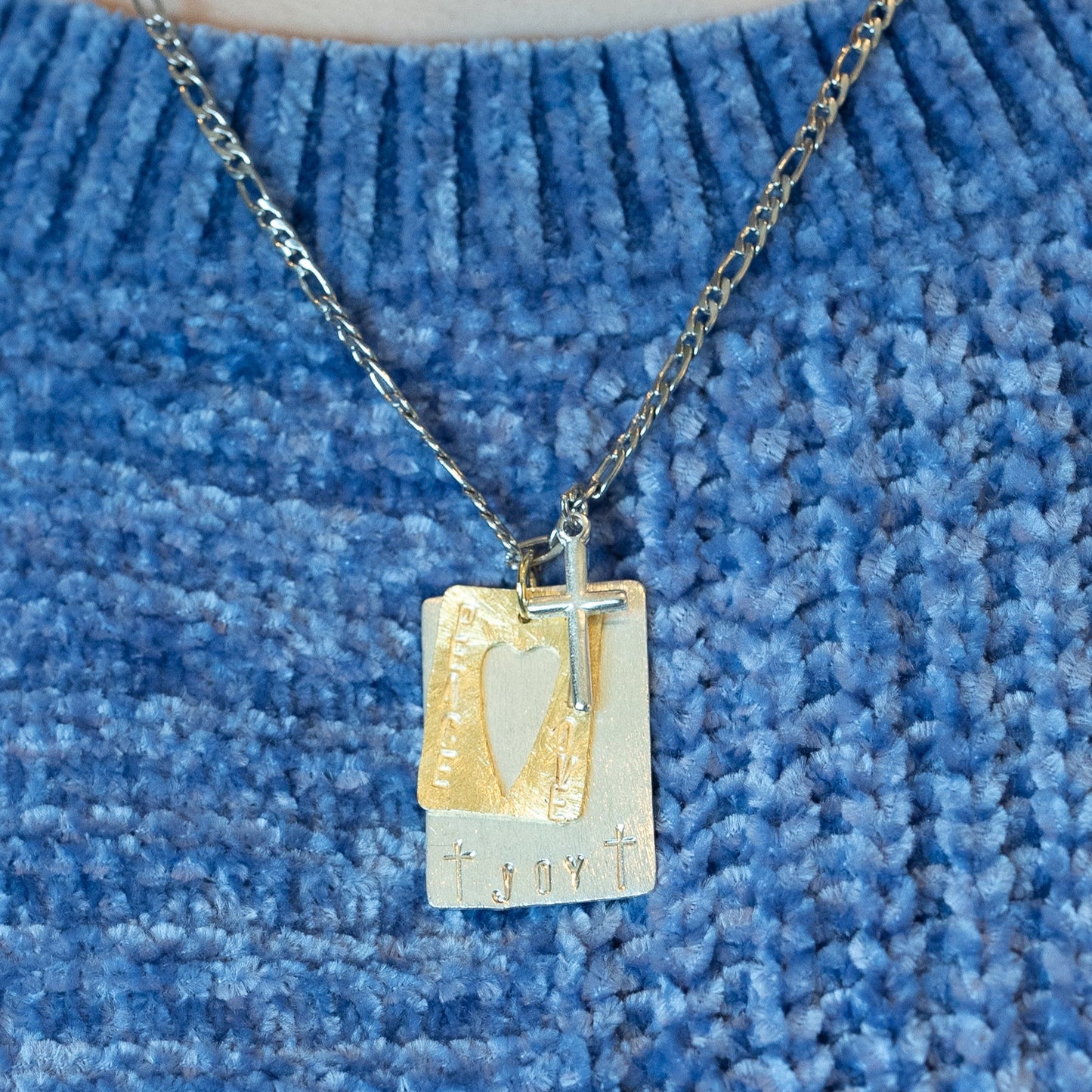 Custom necklaces that feature beautifully hand-stamped pendants and charms. Birthstones can be added to any pendant