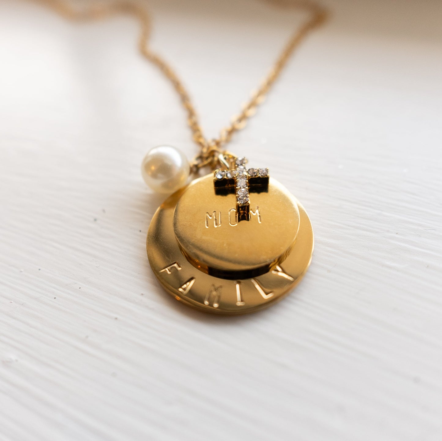 Custom necklaces that feature beautifully hand-stamped pendants and charms. Birthstones can be added to any pendant